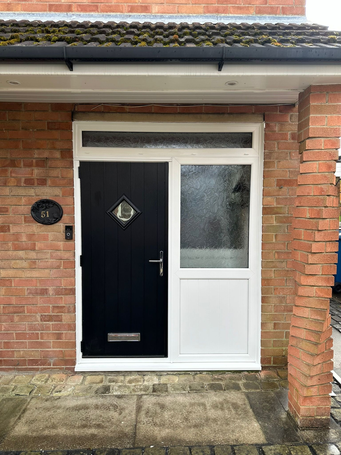 Black plank-effect composite door with diamond window and frosted side panel fitted in Stoke-on-Trent