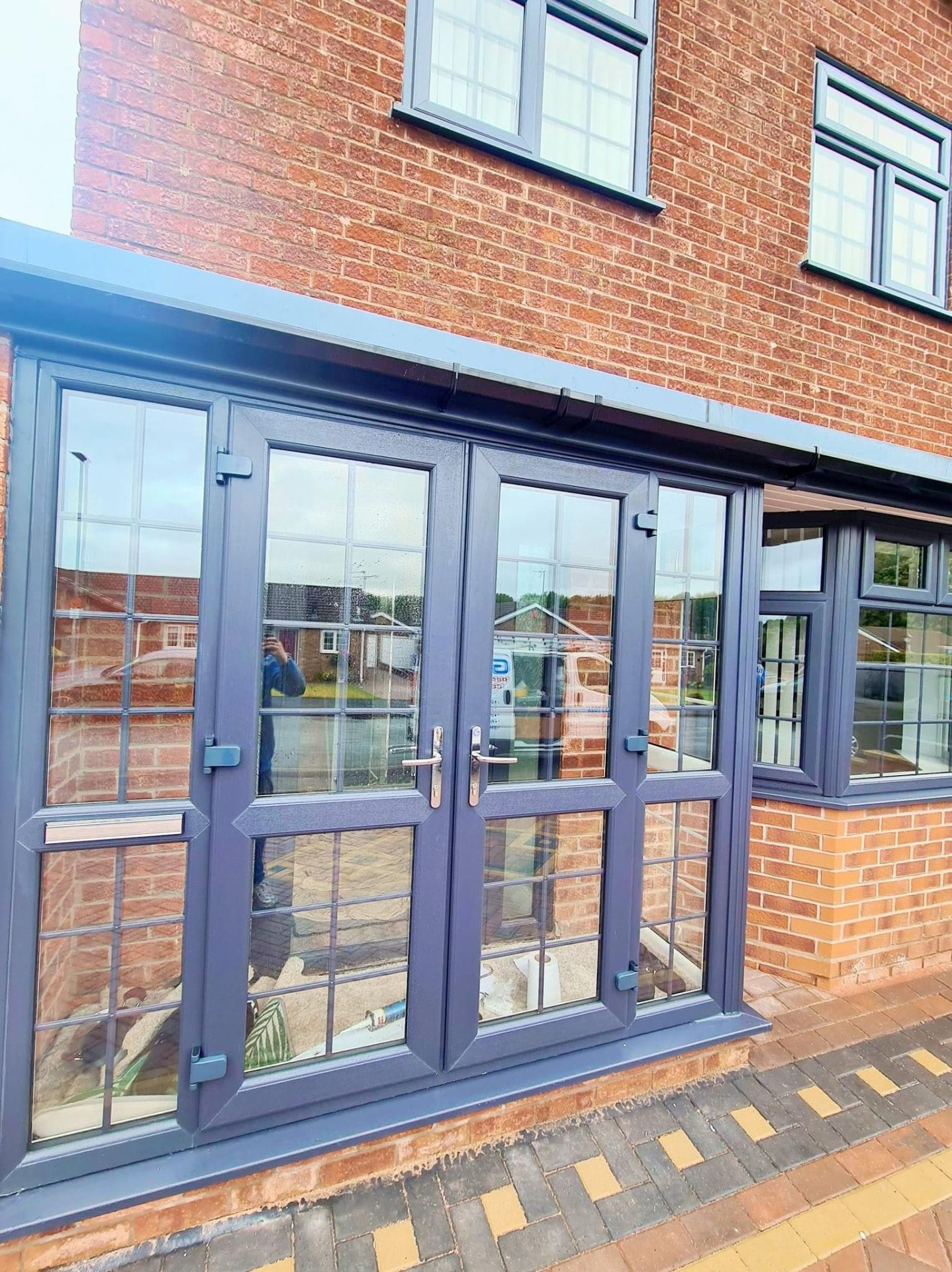 Anthracite grey French doors with leaded glass detailing fitted to a local home