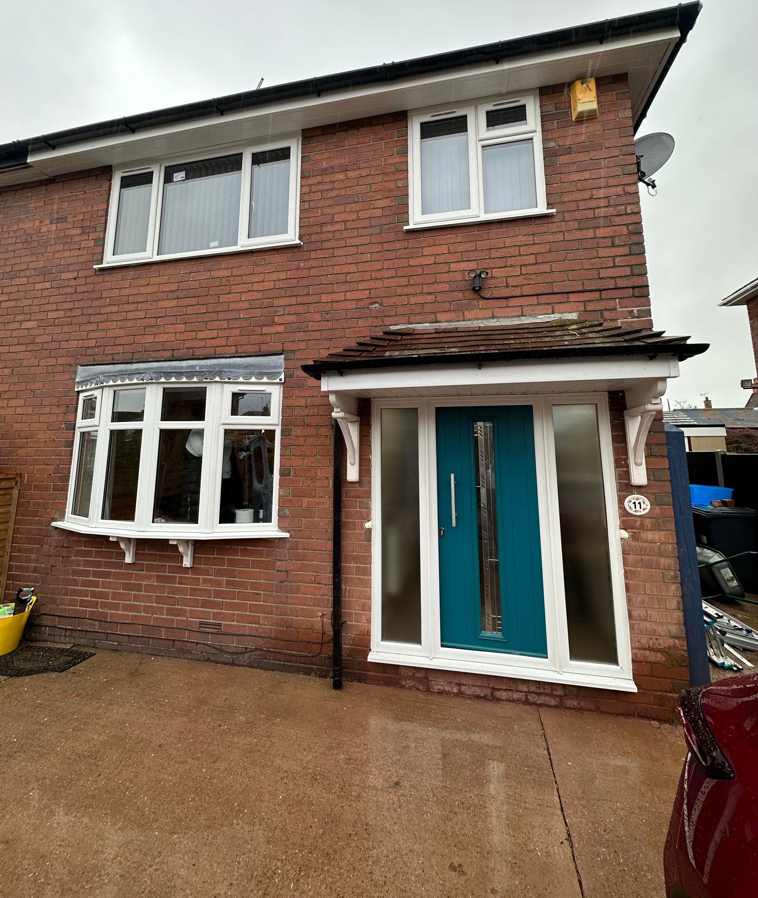 Teal composite front door and full house uPVC window installation in Staffordshire