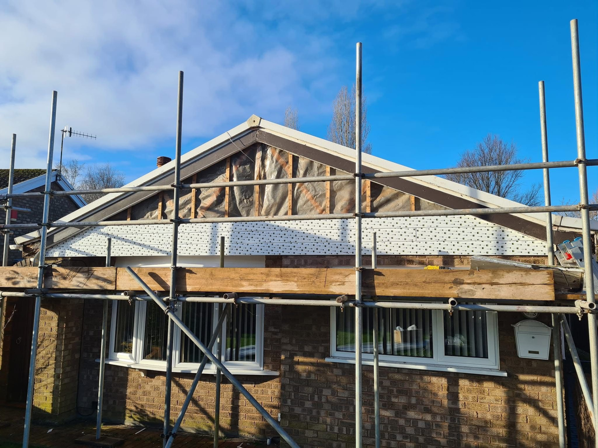 Roofline replacement in progress from scaffolding